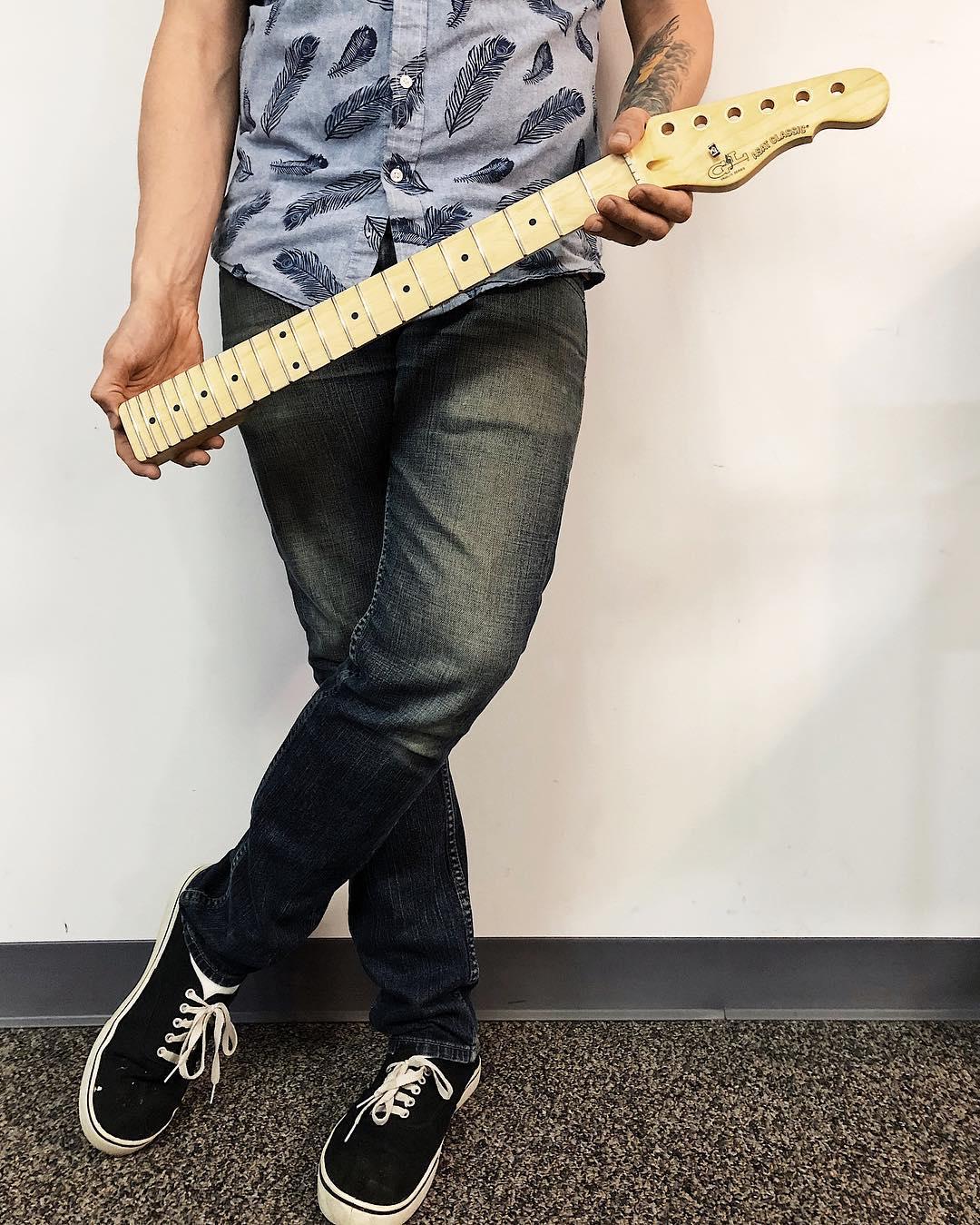 Holding a guitar neck for repair